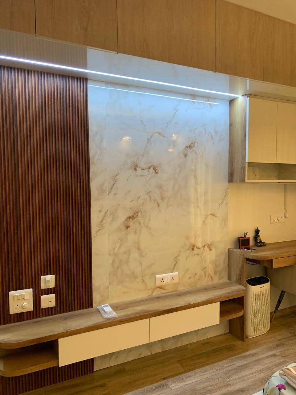TV unit with marble wall in living area